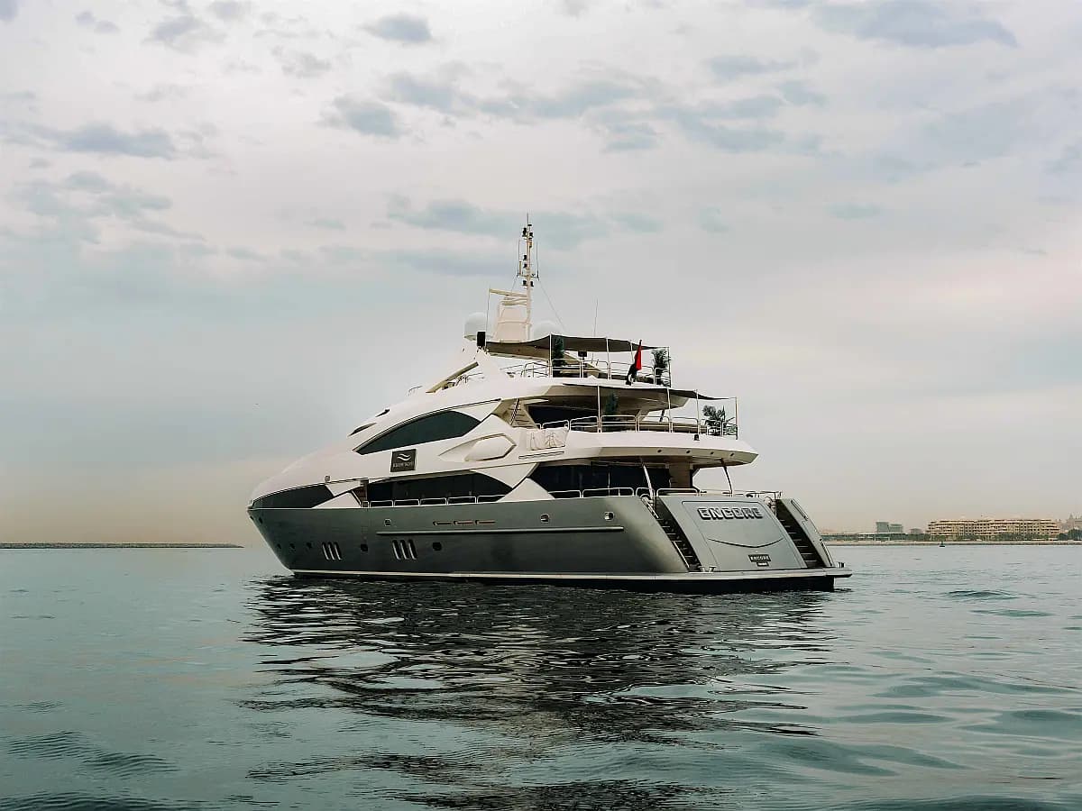 Sunseeker 40M Encore, a 131 ft yacht from our Dubai Harbour fleet, at anchor on calm water